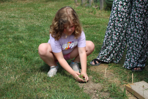  student planting a plant